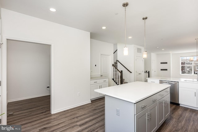 7241 Martin Farm Cir, Baltimore, MD 21237 - kitchen with dishwasher, a kitchen island, dark wood-type flooring, light countertops, and pendant lighting