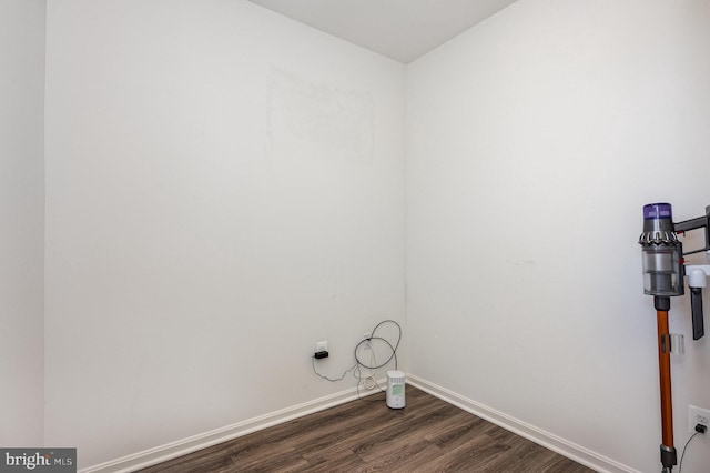 7241 Martin Farm Cir, Baltimore, MD 21237 - laundry area featuring dark wood-style floors and baseboards