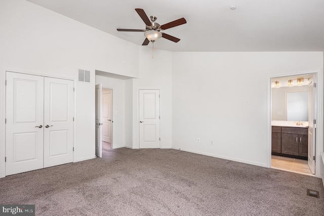 7241 Martin Farm Cir, Baltimore, MD 21237 - unfurnished bedroom with light carpet, ensuite bathroom, baseboards, high vaulted ceiling, and ceiling fan