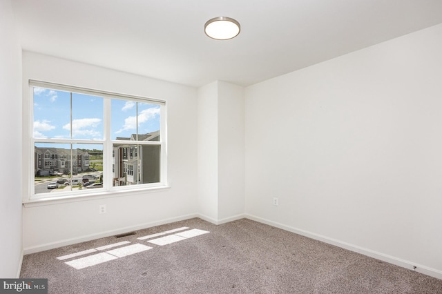 7241 Martin Farm Cir, Baltimore, MD 21237 - spare room featuring carpet flooring and baseboards