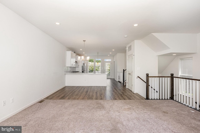 7241 Martin Farm Cir, Baltimore, MD 21237 - unfurnished living room with dark colored carpet, recessed lighting, baseboards, and dark wood-type flooring