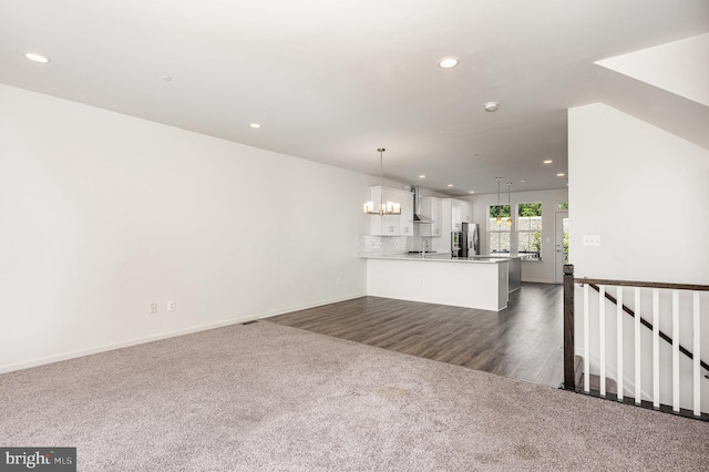 7241 Martin Farm Cir, Baltimore, MD 21237 - unfurnished living room featuring recessed lighting, dark colored carpet, baseboards, and a chandelier