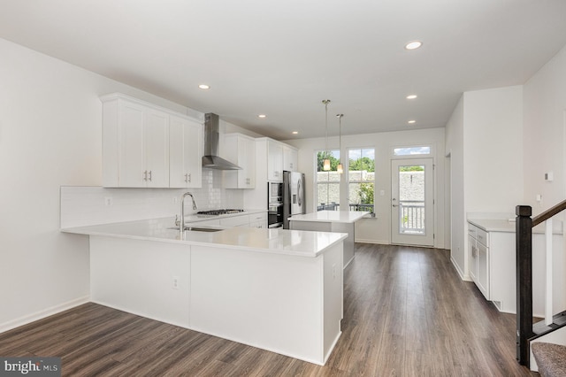 7241 Martin Farm Cir, Baltimore, MD 21237 - kitchen with wall chimney range hood, a sink, dark wood-style flooring, light countertops, and tasteful backsplash