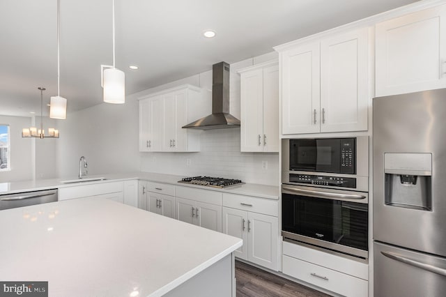 7241 Martin Farm Cir, Baltimore, MD 21237 - kitchen with stainless steel appliances, wall chimney exhaust hood, a sink, light countertops, and recessed lighting