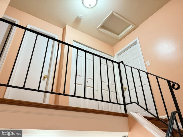 staircase featuring attic access