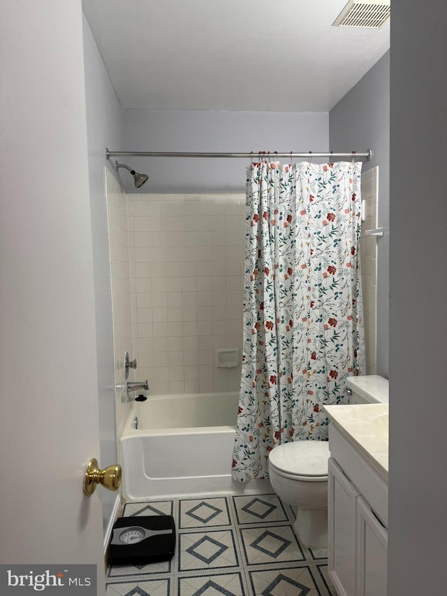 bathroom with shower / bath combo, vanity, toilet, tile patterned floors, and visible vents