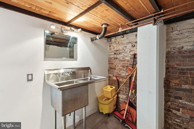 interior space with a dry bar and brick wall