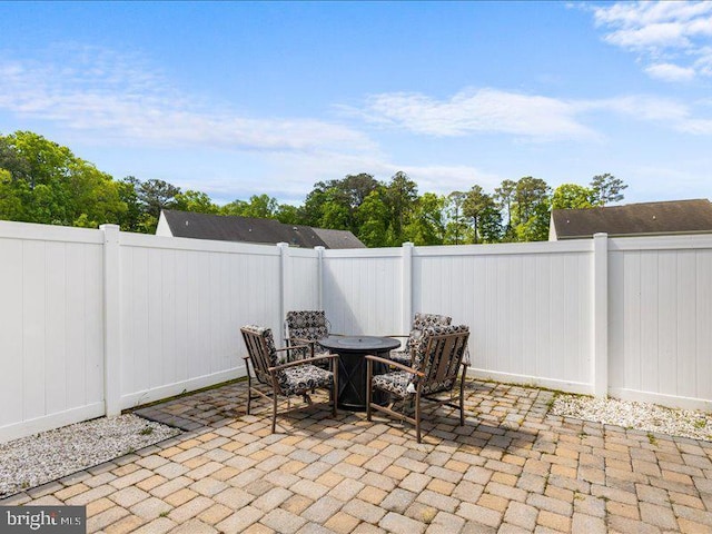 314 Schooner Ln, Berlin, MD 21811 - view of patio / terrace with a fenced backyard and a fire pit