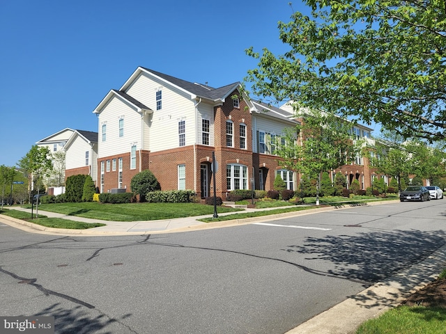 exterior space with brick siding