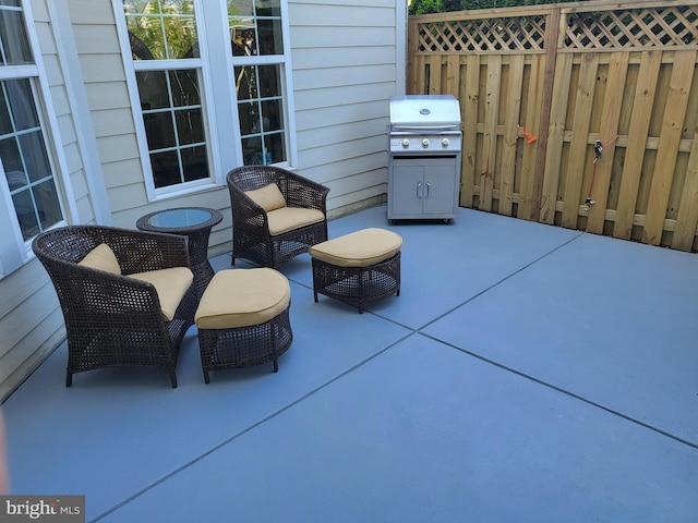 view of patio / terrace with fence and grilling area