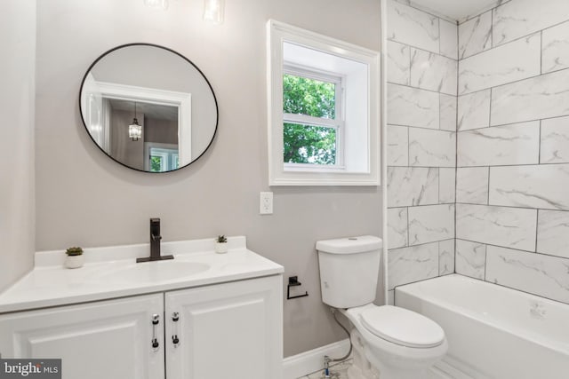 full bath featuring baseboards, vanity, and toilet