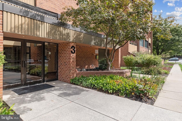 3 Southerly Ct Unit 602, Towson, MD 21286 - doorway to property with brick siding and french doors