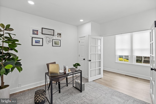 home office with french doors, wood finished floors, baseboards, and recessed lighting