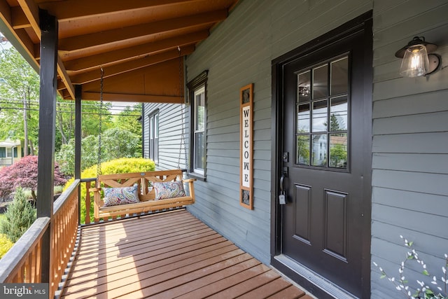 wooden deck featuring covered porch