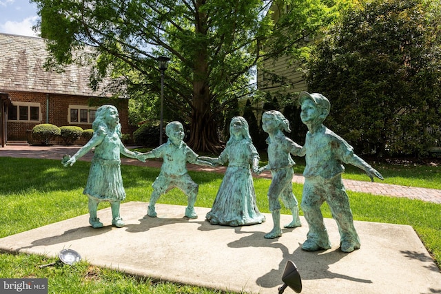 view of home's community with a lawn