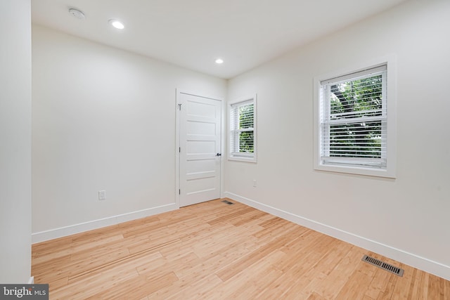 1621 Lyman Pl NE, Washington, DC 20002 - empty room with wood finished floors, baseboards, a smoke detector, and recessed lighting
