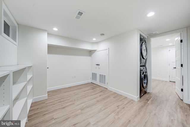 1621 Lyman Pl NE, Washington, DC 20002 - below grade area featuring estacked washer and dryer, light wood-type flooring, recessed lighting, and baseboards