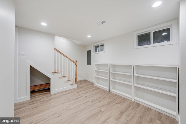 1621 Lyman Pl NE, Washington, DC 20002 - finished basement with electric panel, wood finished floors, stairs, recessed lighting, and baseboards