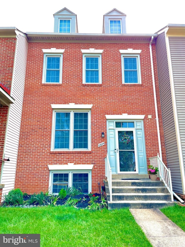 multi unit property featuring brick siding