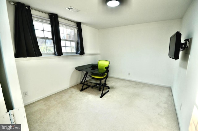 interior space featuring carpet floors, baseboards, and visible vents