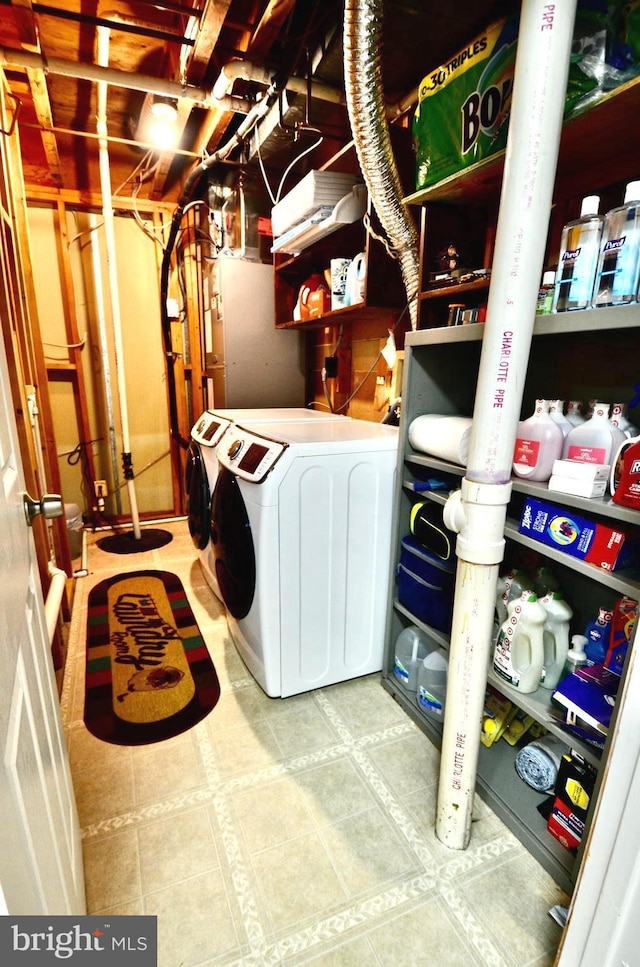 washroom featuring laundry area, tile patterned flooring, and washer and dryer