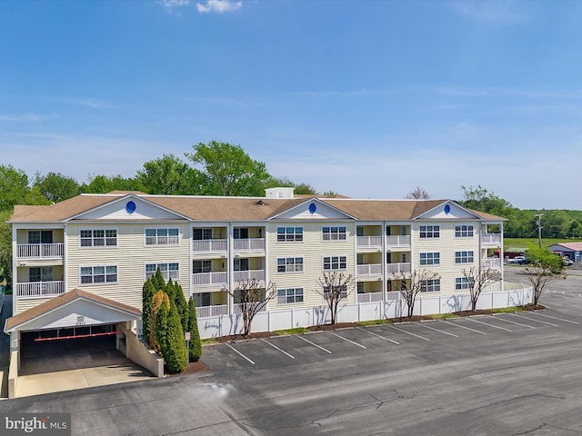 30413 Cedar Neck Rd Unit 304, Ocean View, DE 19970 - view of apartment building / complex featuring uncovered parking