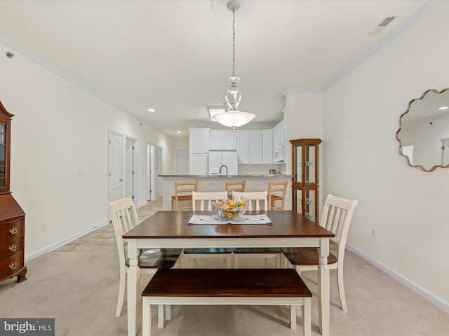 30413 Cedar Neck Rd Unit 304, Ocean View, DE 19970 - dining room featuring light colored carpet, crown molding, and baseboards