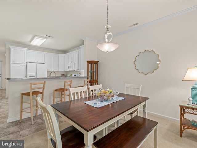 30413 Cedar Neck Rd Unit 304, Ocean View, DE 19970 - dining space with ornamental molding and baseboards