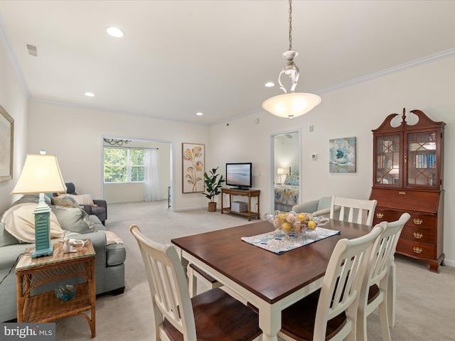 30413 Cedar Neck Rd Unit 304, Ocean View, DE 19970 - dining area with light colored carpet, crown molding, recessed lighting, and baseboards