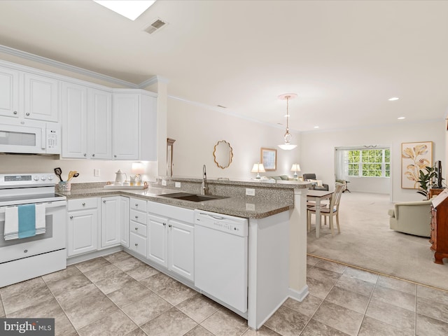 30413 Cedar Neck Rd Unit 304, Ocean View, DE 19970 - kitchen with white appliances, a sink, a peninsula, white cabinets, and pendant lighting