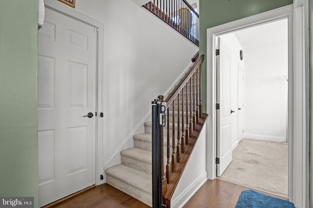 323 Palton Rd, Bensalem, PA 19020 - stairway with baseboards and wood finished floors