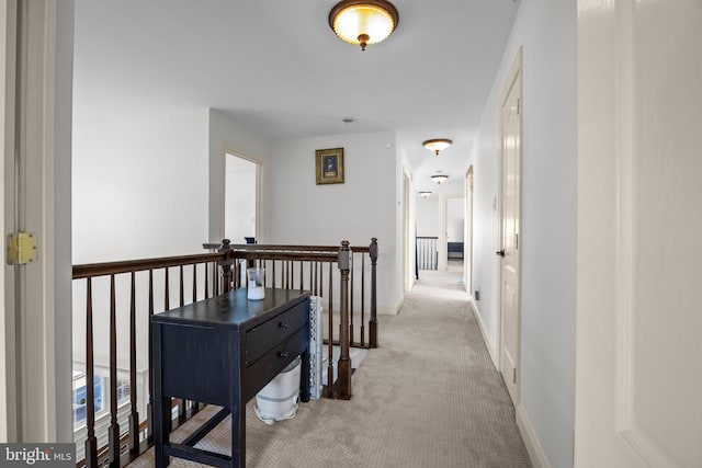 323 Palton Rd, Bensalem, PA 19020 - hall with an upstairs landing, light carpet, and baseboards