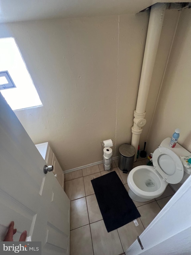 bathroom featuring tile patterned flooring and toilet