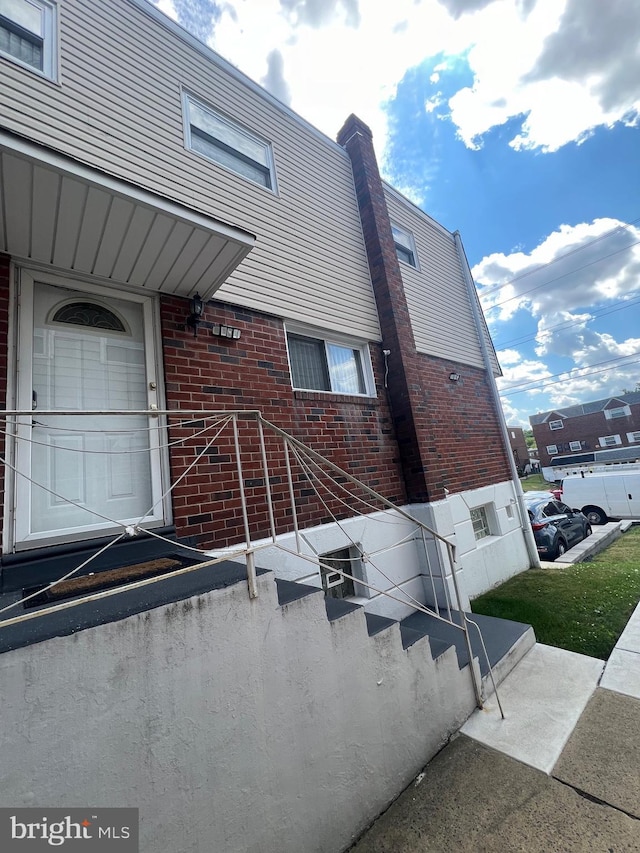 entrance to property with brick siding