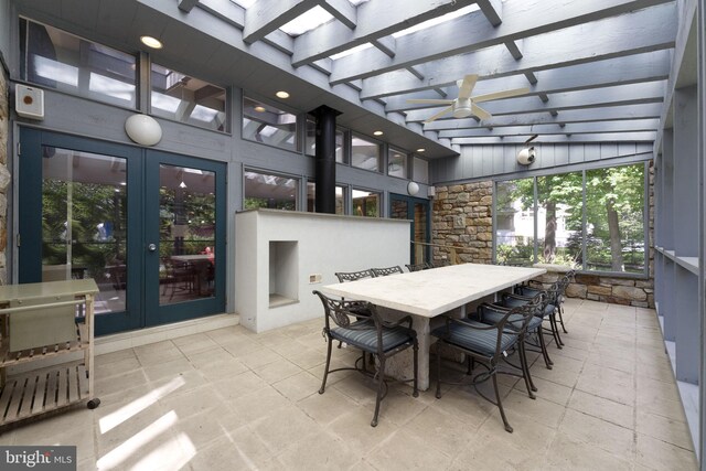 sunroom with french doors and beam ceiling