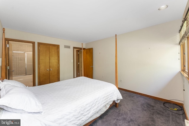 bedroom featuring carpet floors, baseboards, and ensuite bathroom