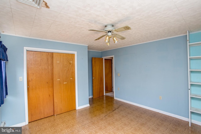 unfurnished bedroom with a ceiling fan, baseboards, and a closet