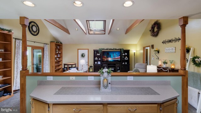 kitchen with lofted ceiling, carpet flooring, open floor plan, and recessed lighting