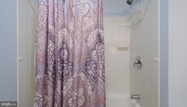 bathroom featuring shower / bath combination with curtain