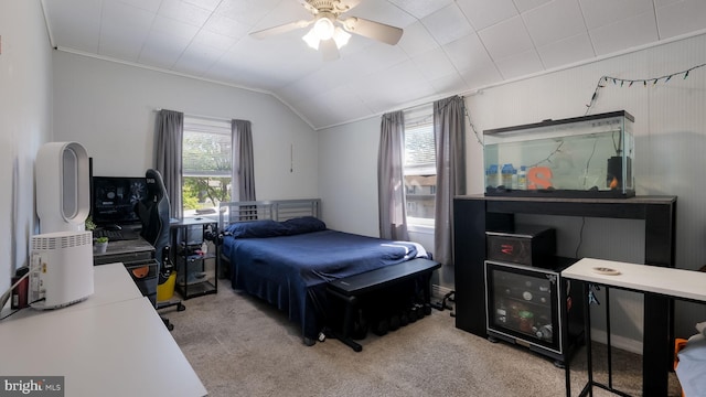 bedroom featuring carpet, vaulted ceiling, ceiling fan, and crown molding