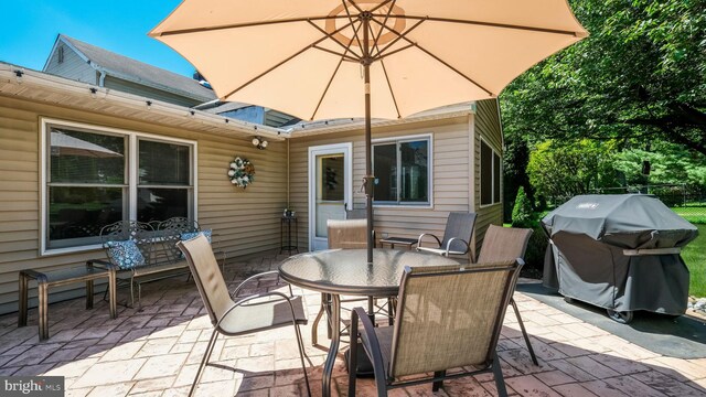 view of patio featuring a grill and outdoor dining space