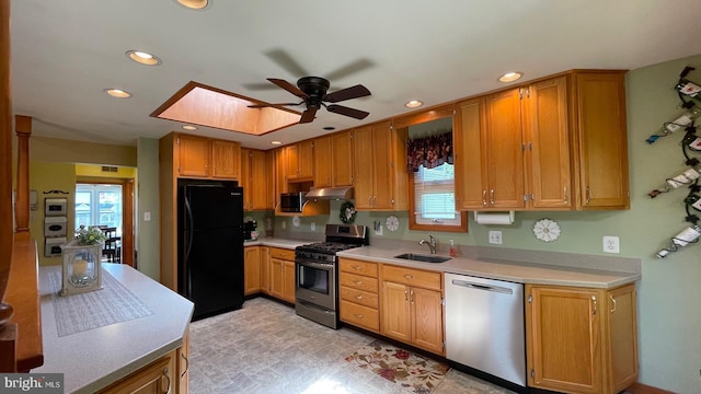 kitchen featuring appliances with stainless steel finishes, a ceiling fan, light countertops, recessed lighting, and plenty of natural light