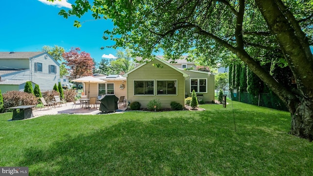 back of property with a patio