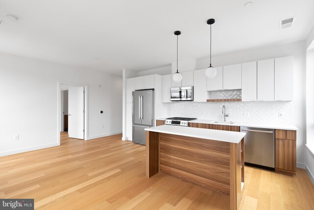 7175 12th St NW Unit 506, Washington, DC 20011 - kitchen featuring stainless steel appliances, baseboards, visible vents, and a sink