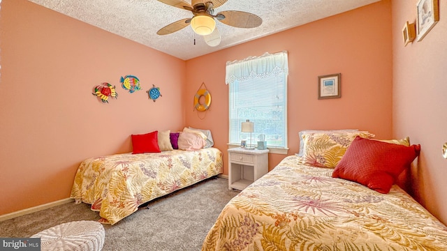 carpeted bedroom featuring a ceiling fan, a textured ceiling, and baseboards