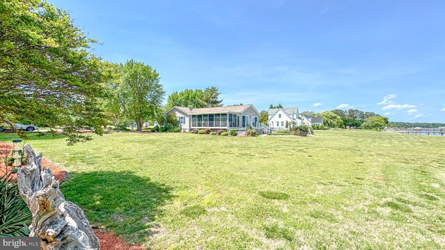 view of yard with a sunroom