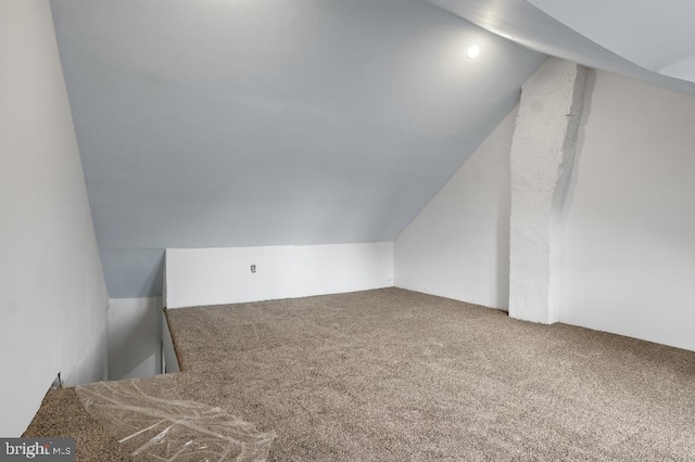 bonus room featuring carpet flooring and lofted ceiling