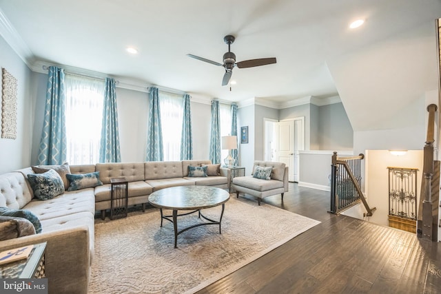 living area with recessed lighting, dark wood finished floors, crown molding, a ceiling fan, and baseboards