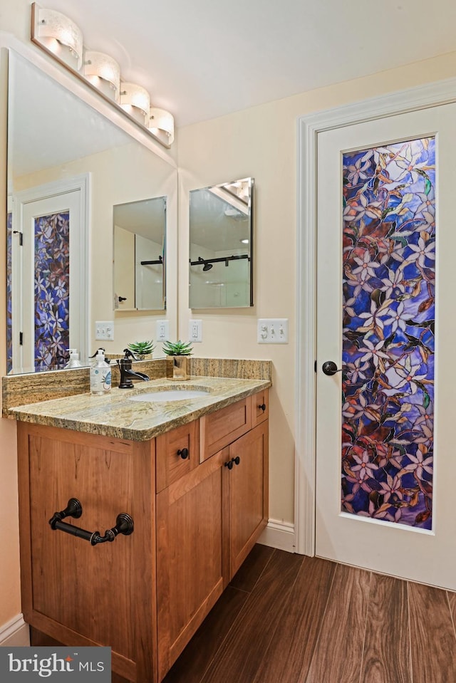 1716 Saddle Ridge Ct, Vienna, VA 22182 - bathroom featuring wood finished floors and vanity