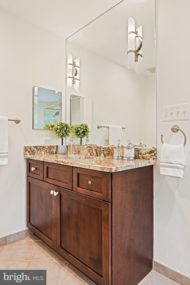 1716 Saddle Ridge Ct, Vienna, VA 22182 - bathroom featuring tile patterned floors, baseboards, and vanity